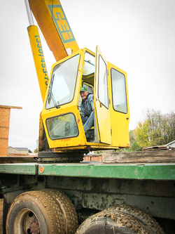 cei-crane-operator-looks-out-of-crane-smiling-sm